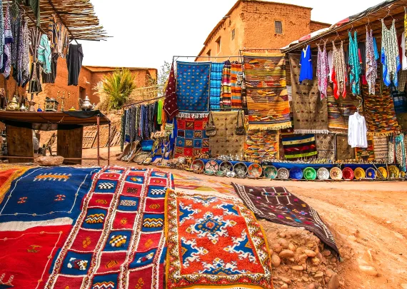 A moroccon rug lying on sand
