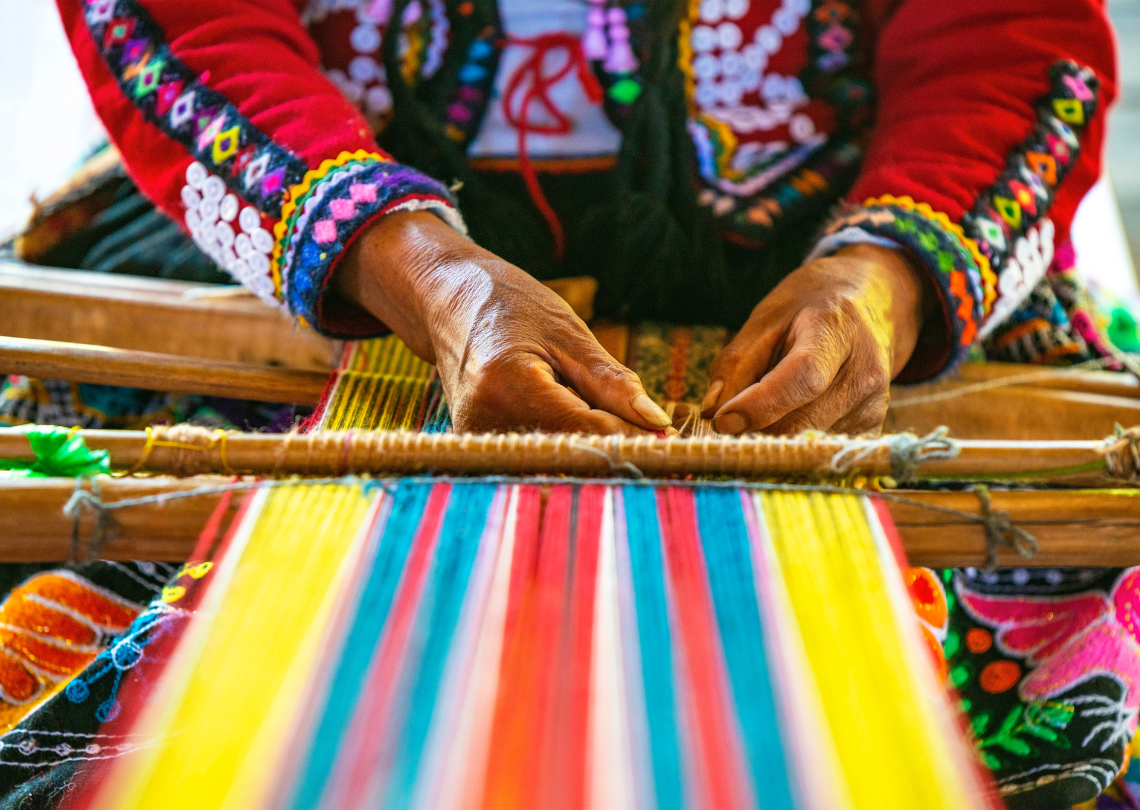 Lady knitting with colourful strings